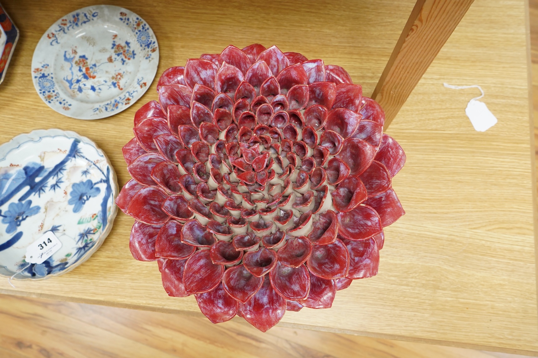 Frances Doherty, a Bishop's Pom Pom ceramic sculpture, with red glaze, 40cm wide